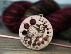 Knitting Needle Gauge Guide with a sheep standing on a grassy hill - Cherry wood with bronze clasp
